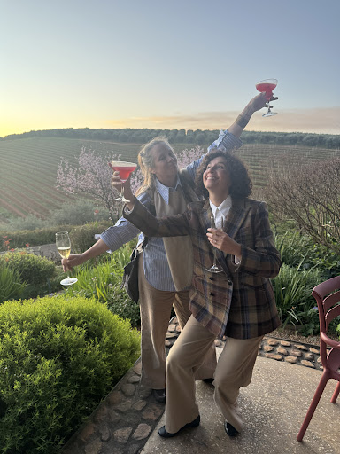 Workshop guests raising glasses in the Cape Winelands in a photograph by Lisa Malloy